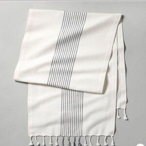 Hearth and Hand cotton blue and white striped  table runner with tassels.